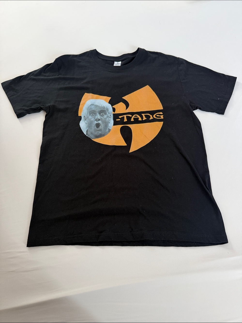 Black Short-Sleeve Graphic Tee with Orange Logo